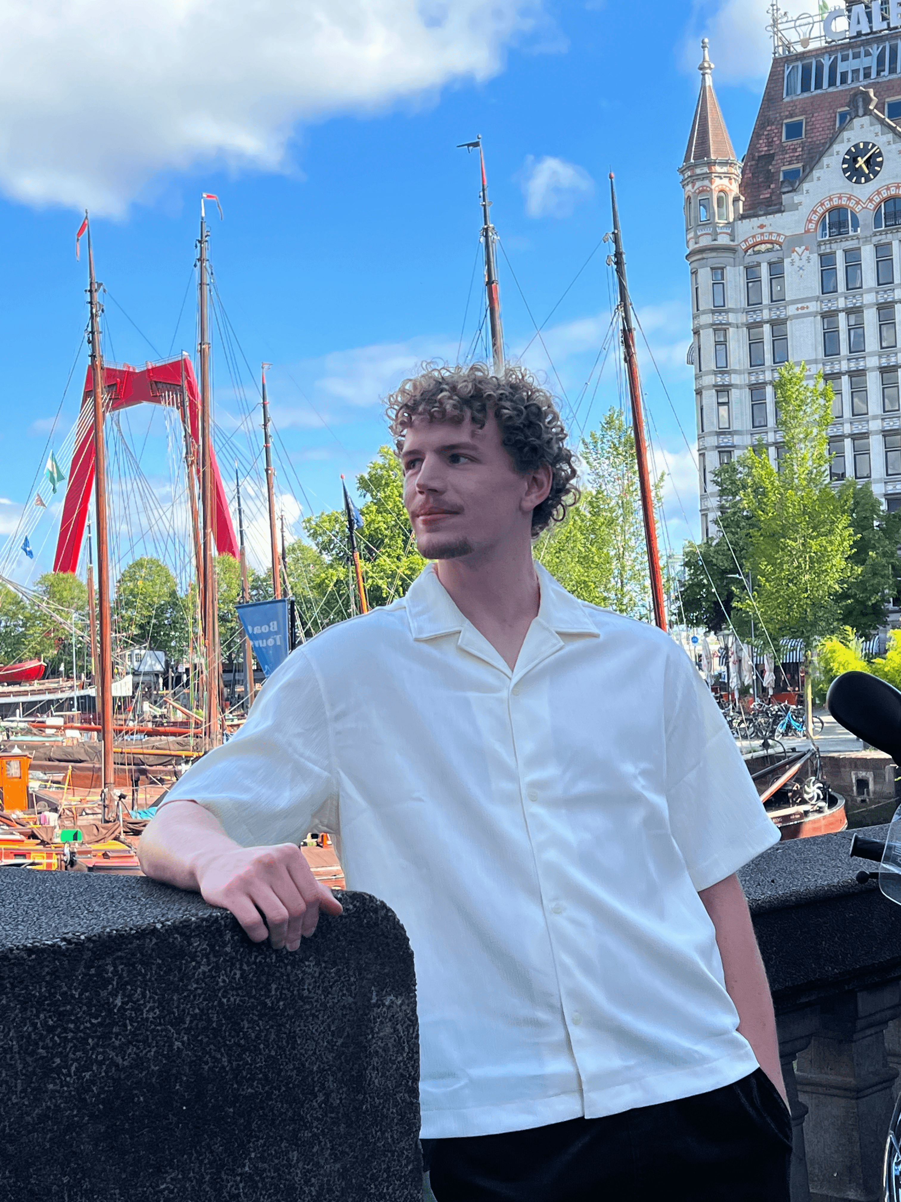 Raul Rohjans standing by a harbor.